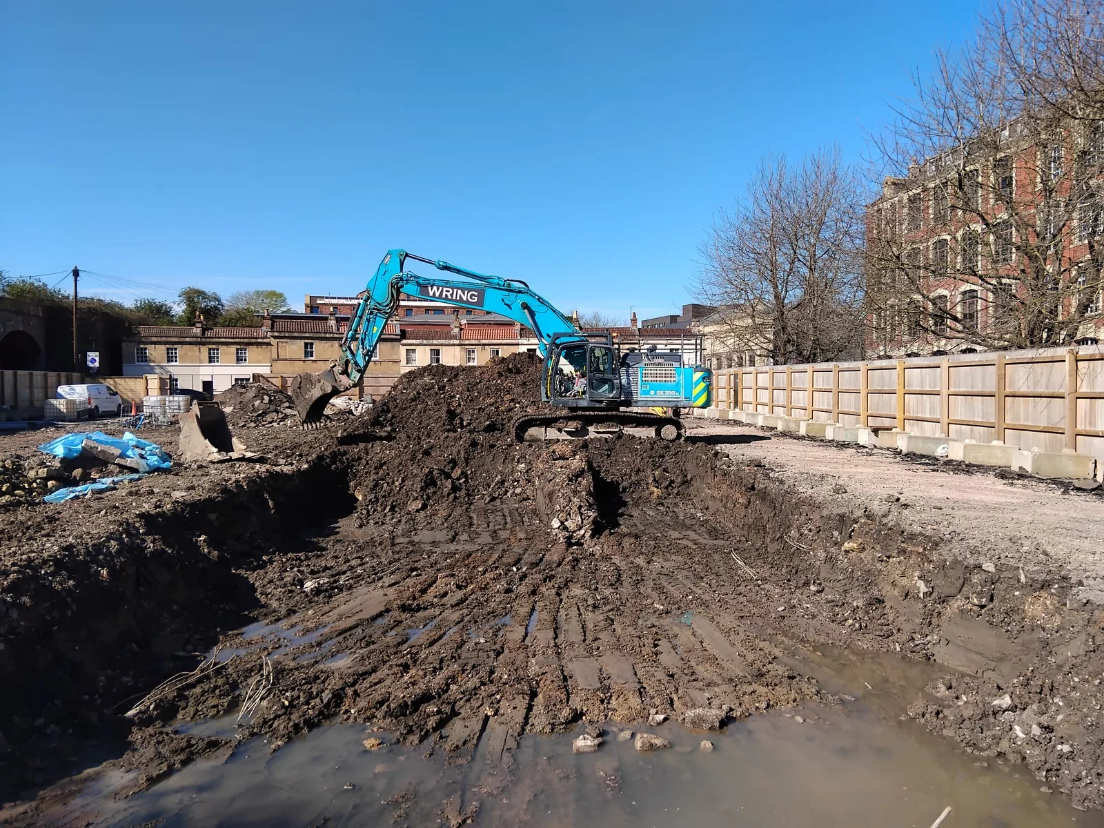 The Beazer House site in Bath following demolition, with a Wring excavator carrying out groundworks